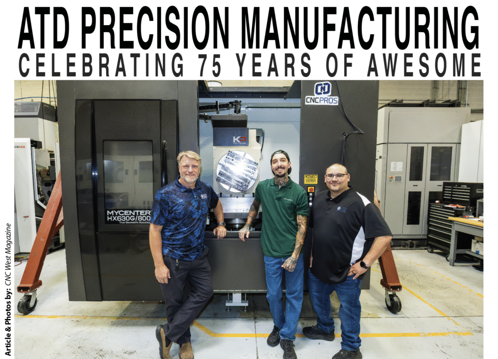 Photo of 3 men in front of CNC mill
